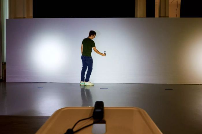 A person testing the light output of the Nitecore EDC27 Ultra Slim Flashlight.