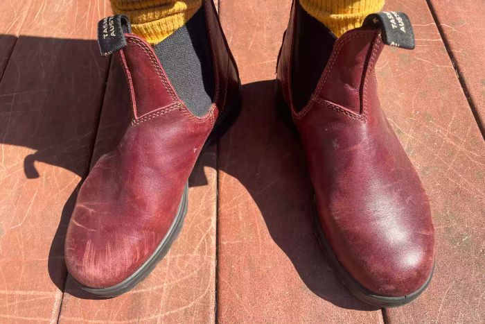 A person is seen wearing the Blundstone #1352 Women's Originals High Top Boots