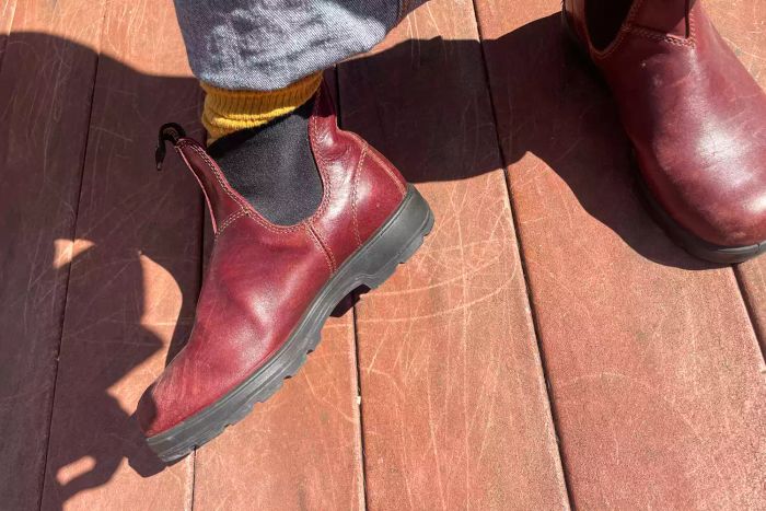 A person is seen wearing the Blundstone #1352 Women's Originals High Top Boots