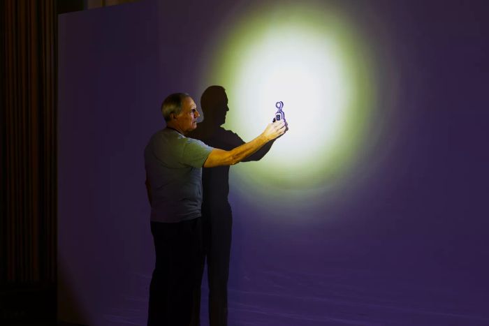 person assessing the light emitted from a Stanley Fatmax Rechargeable Lithium Ion LED Spotlight Flashlight
