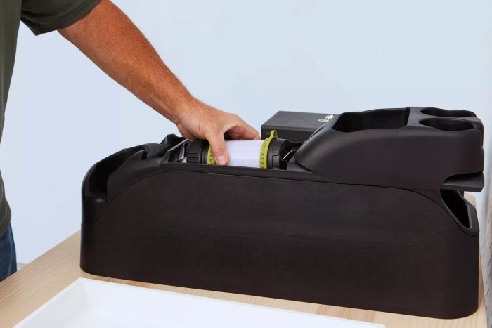 A person storing the Lighting Ever 3300019 Rechargeable LED Camping Lantern.