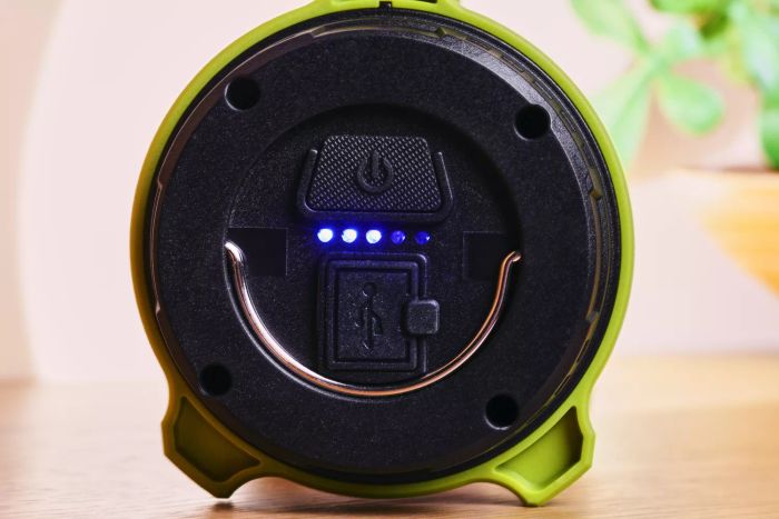A close-up shot of the charge indicator on the Lighting Ever 3300019 Rechargeable LED Camping Lantern.