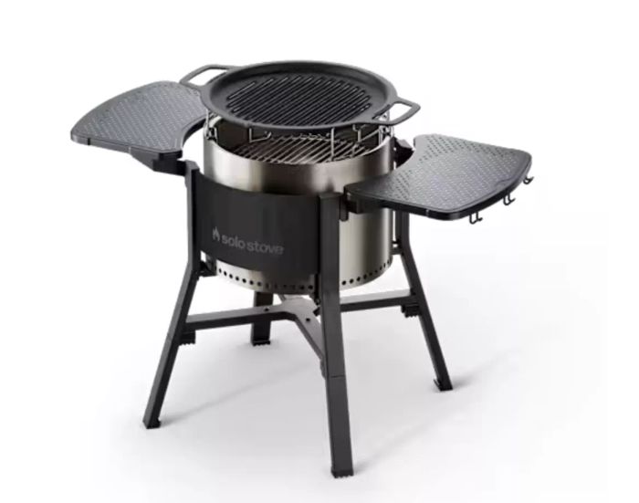 a Solo Stove with a grill kit attached