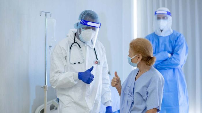 Patient and doctor giving a thumbs up