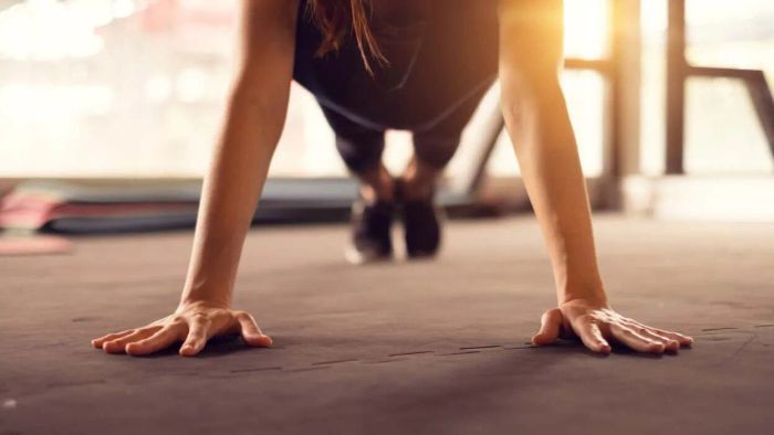 individual getting ready to perform a pushup