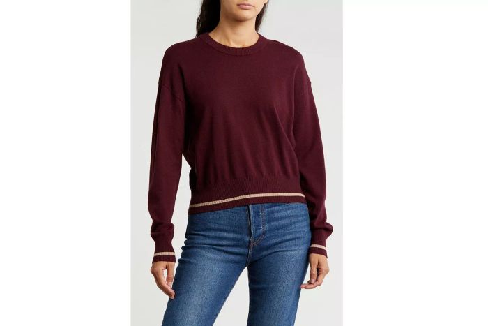 This crewneck sweater is a versatile wardrobe staple with a chic design.