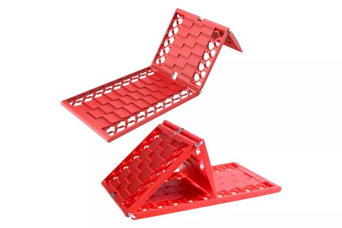 The WawaAuto Foldable Emergency Tire Traction Pad is a must-have car accessory for emergencies. It helps free your vehicle from being stuck in snow, ice, mud, or sand. The set includes two pads, providing durable support when you need it most.