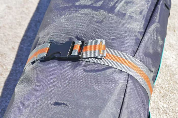 A close-up view of the clipped strap on the WhiteFang 3-Person Beach Tent