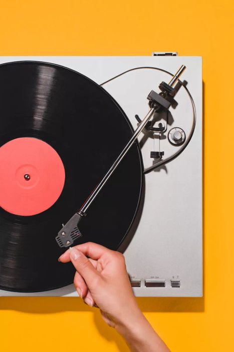 Holiday gathering vibes come alive with a record player spinning timeless tunes, setting the perfect atmosphere.