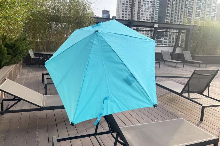 Sport-Brella Versa-Brella SPF 50+ Adjustable Umbrella set up over a deck chair.