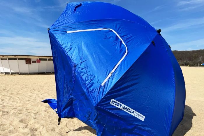 Sport-Brella Premiere 8-foot Outdoor Umbrella set up on the beach.