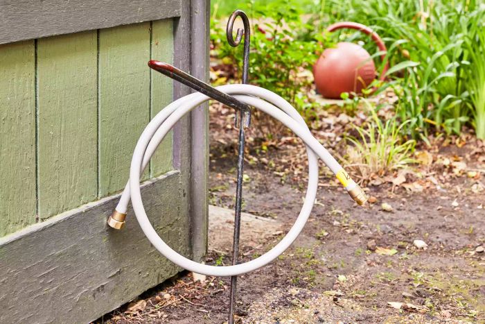 Eley 5/8-Inch Polyurethane Garden Hose showcased on a hose rack.