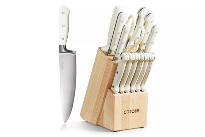 Carote 14-Piece Knife Set includes a chef's knife, bread knife, utility knife, paring knife, six steak knives, kitchen shears, and a sharpener, all neatly arranged in a wooden block. At only $50, this knife set offers the best value with the largest discount.