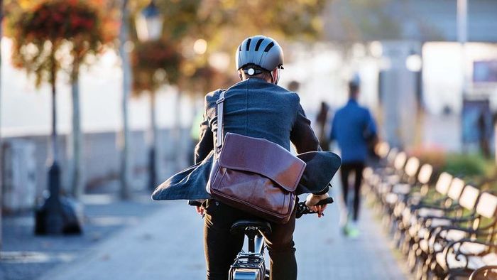 A person riding a bike on their way to work