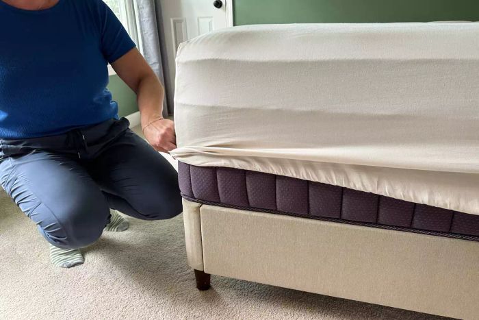 A person holding the Cozy Earth Bamboo Sheet Set
