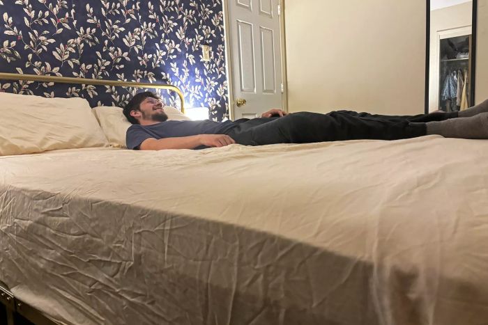 A person relaxes on the Cosy House Collection Luxury Bed Sheets.