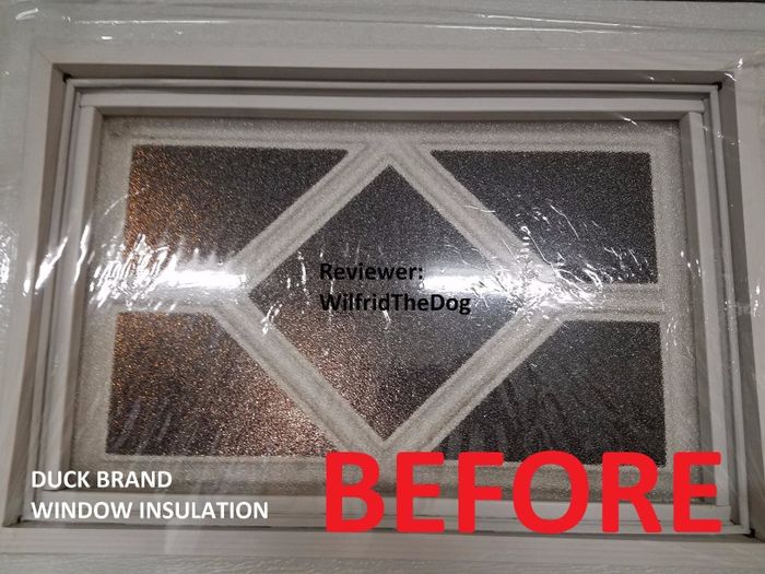 A reviewer's photo of the insulating film taped to a window