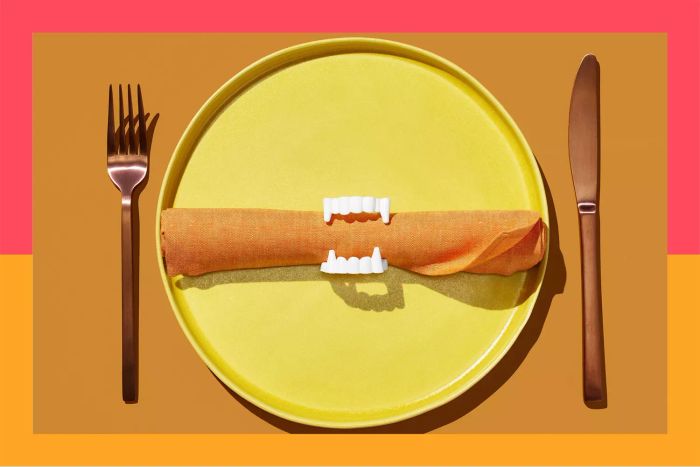 plate with a napkin and fake fangs