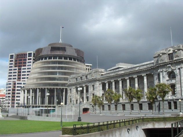 The New Zealand Parliament Buildings are a noteworthy landmark in Wellington, though they have remained far from complete. Originally planned in 1911, the construction was to unfold in two phases: one for the essential legislative chambers, and another for secondary spaces like the library and the Crown Law Office. Despite the ambitious plans, the project was delayed, with construction starting only in 1914 and the first stage being completed in 1922, partly due to the disruption of World War I. The second stage was never realized, and so the Parliament Buildings were not formally opened until 1995. Although still incomplete, a new structure, the Beehive, now fills the remaining space, ensuring some functionality.