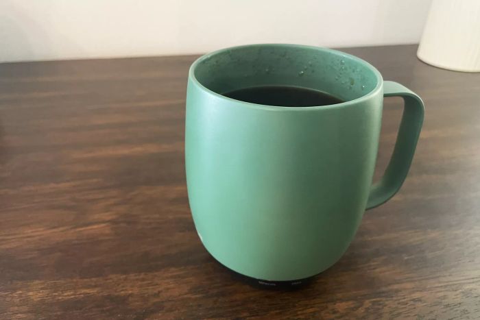 Nextmug Temperature-Controlled Self-Heating Coffee Mug showcased on a wooden table