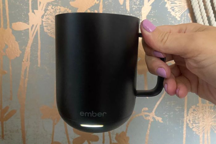 Hand holding the Ember Mug 2