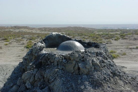 In the spring of 2001, volcanic activity beneath the Caspian Sea off Azerbaijan's coast led to the formation of a new island. Later that year, in October, a significant volcanic eruption occurred in Azerbaijan at Lokbatan, though it resulted in no casualties or evacuations. While Azerbaijan doesn't have any active volcanoes in the conventional sense, it is home to hundreds of mud volcanoes. These unique formations are related to regular magmatic volcanoes but are typically less dangerous. They erupt infrequently, with some spectacularly erupting every twenty years, sending flames soaring hundreds of meters into the sky and covering the surrounding area in thick mud. In one eruption, the flames could be seen from 15 kilometers away, and they continued burning at a lower intensity for three days.