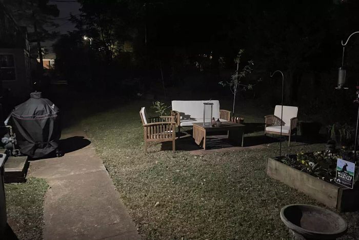 Beams MB360XT 200 Lumen Battery Powered Motion Sensing LED Spotlight casting light across the yard at night