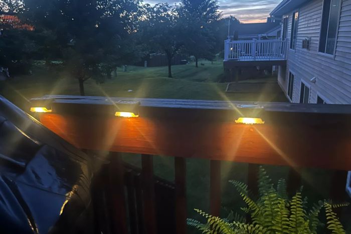 The SOLPEX Solar Deck Lights illuminated as the sun set