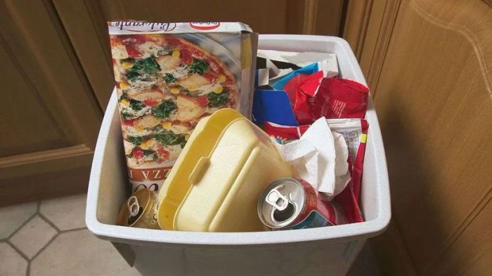 cardboard pizza box, aluminum soda can, waste container