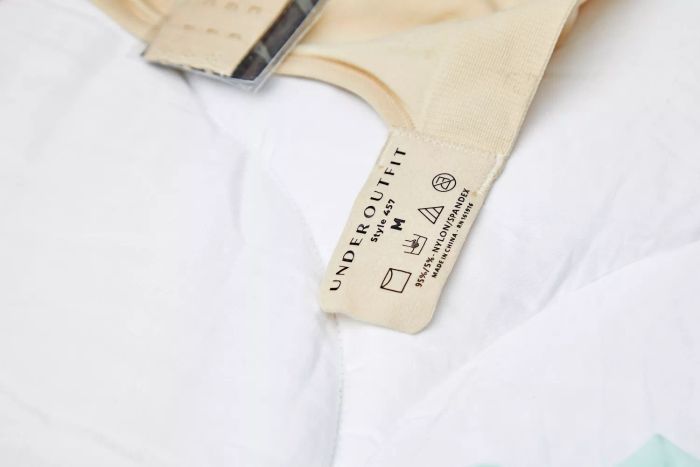The tag attached to the strap of the Underoutfit The Comfort Shaping Bra.