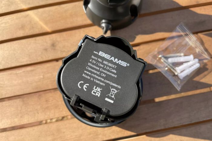 Back angle of the Beams MB360XT 200 Lumen Battery Powered Motion Sensing LED Spotlight positioned on a wooden deck