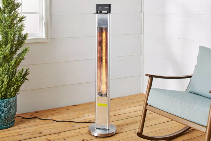 EnerG+ Electric Patio Heater placed on a wooden floor beside a chair.