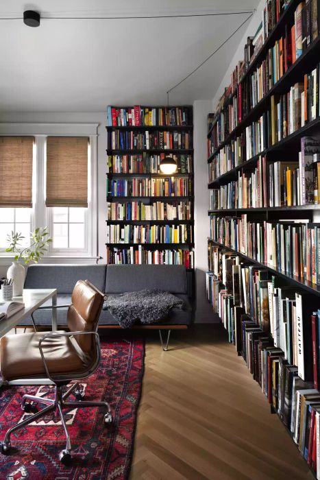 bookshelves in the living room, lining the walls