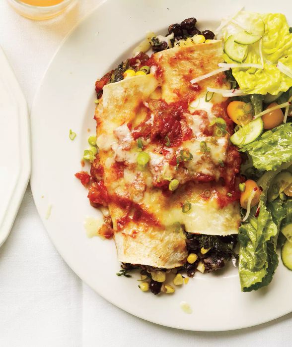 Our Slow-Cooker Bean and Spinach Enchiladas feature a delicious, hearty vegetarian filling. While they may appear complex, they are surprisingly simple to prepare.