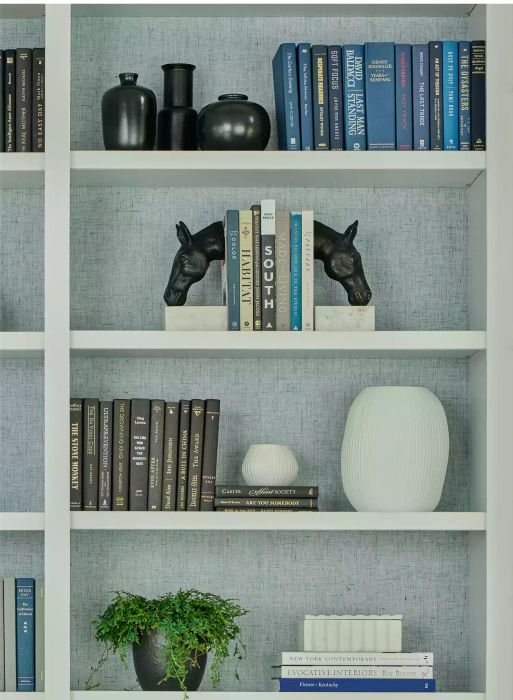 decorative horse-shaped bookends placed on a shelf