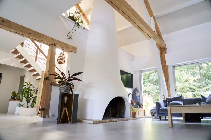 Living room interior featuring a sofa, cushions, and a fireplace