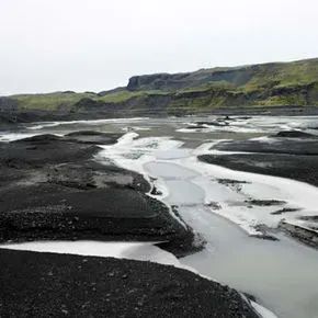 Cloudy meltwater resulting from rock flour on the Myrdalsjokull Glacier.