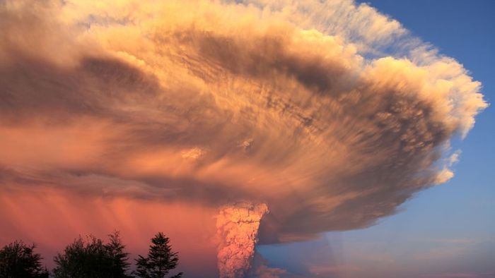 Volcanic ash filling the sky after a volcanic eruption.