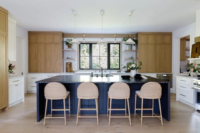 A kitchen island painted in a rich, deep blue shade.