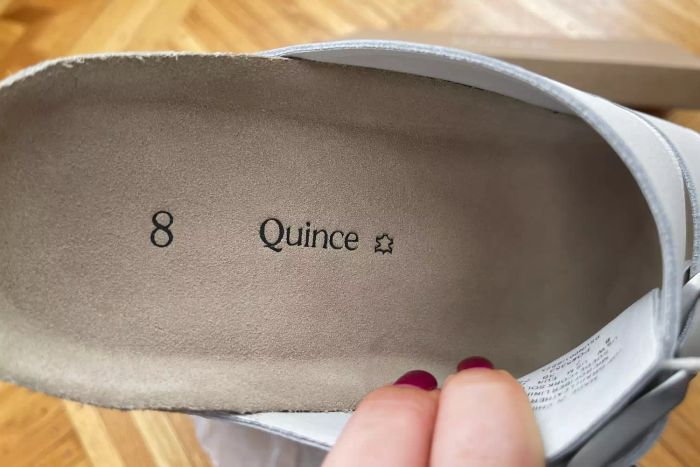 A detailed close-up of the inner sole of the Quince Nappa Leather Double Buckle Slides.