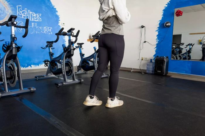 A gym-goer showcases the On Running Movement Tights