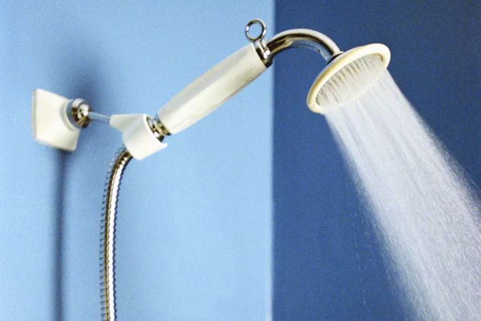 showering under flowing water