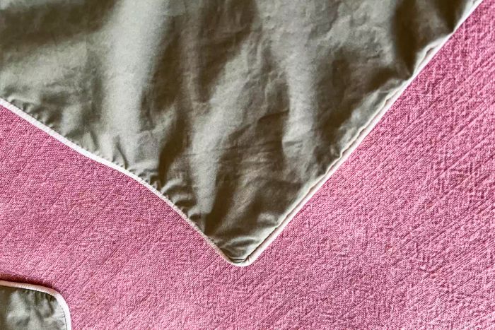 A detailed closeup of the corner of the Brooklinen Classic Percale Pillowcases