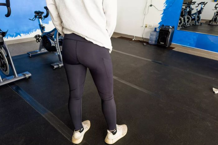 An individual stands modeling the On Running Movement Tights