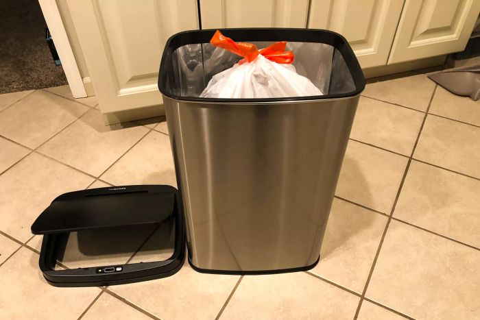 A trash bag placed inside the NINESTARS DZT-50-28 13 Gallon Touchless Motion Sensor Trash Can