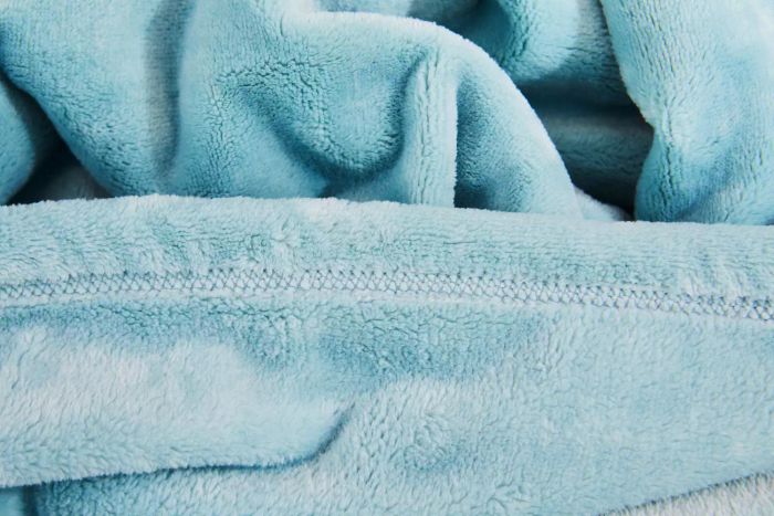 A close-up view of the hem on the L.L. Bean Wicked Cozy Blanket