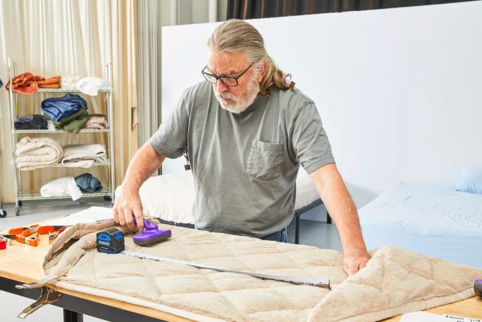 Individual measuring the Garnet Hill Plush-Loft Blanket