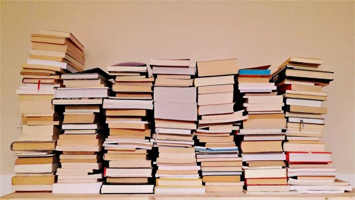 Books stacked against the wall
