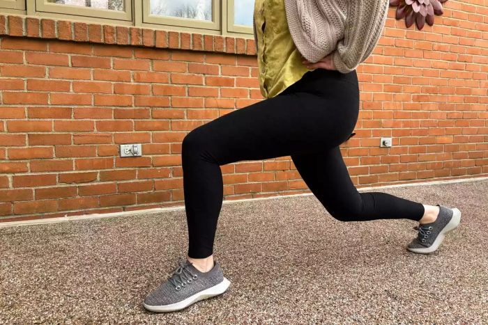 A person engages in a workout wearing Vuori Elevation Ruched Leggings