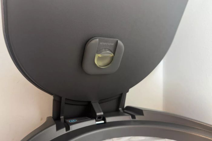 The odor-neutralizing pod attached to the lid of the Simplehuman 12 Gallon Slim Hands-Free Kitchen Step Trash Can